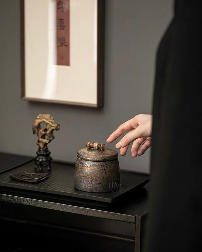 Beautifully detailed gilded tea jar in traditional Chinese stoneware.
