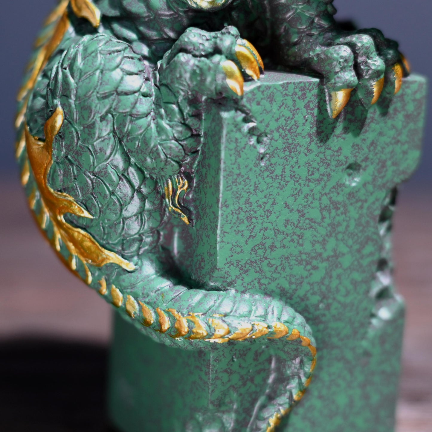 Symbolic dragon tea pet carved from green stone with gold highlights - Tea Culture Collectible