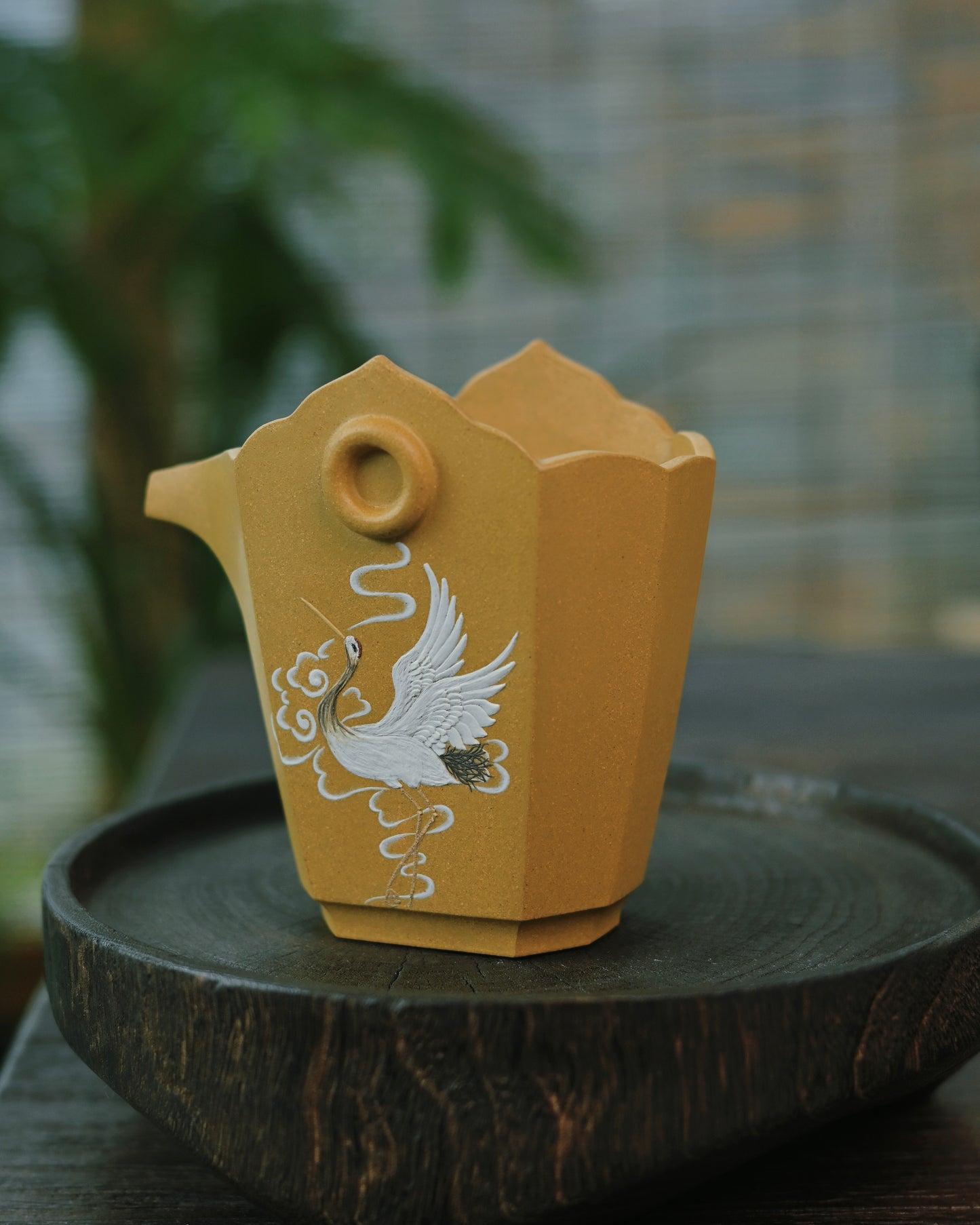 A curated tea setup featuring the Benshan Lüni justice cup alongside a teapot and serving tray
