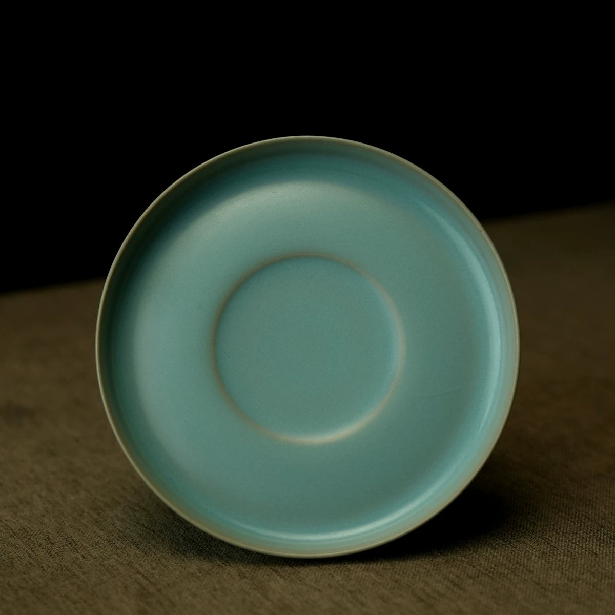 Gongfu tea and coffee setup featuring Ru Ware sky-blue 85ml dragon cup on minimalist table