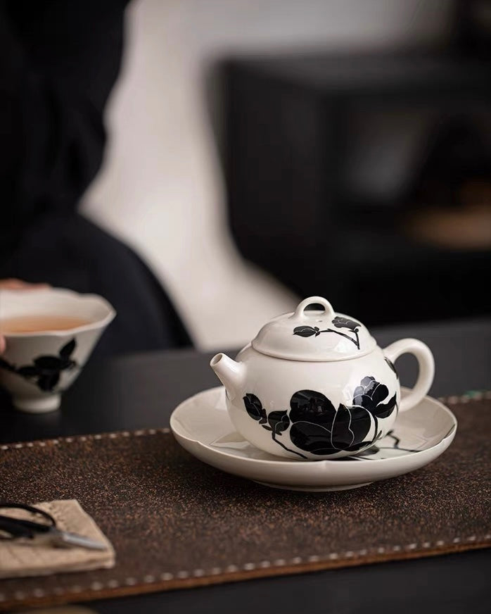 Traditional plant ash glaze teapot with hand-painted black magnolia and seamless pouring spout