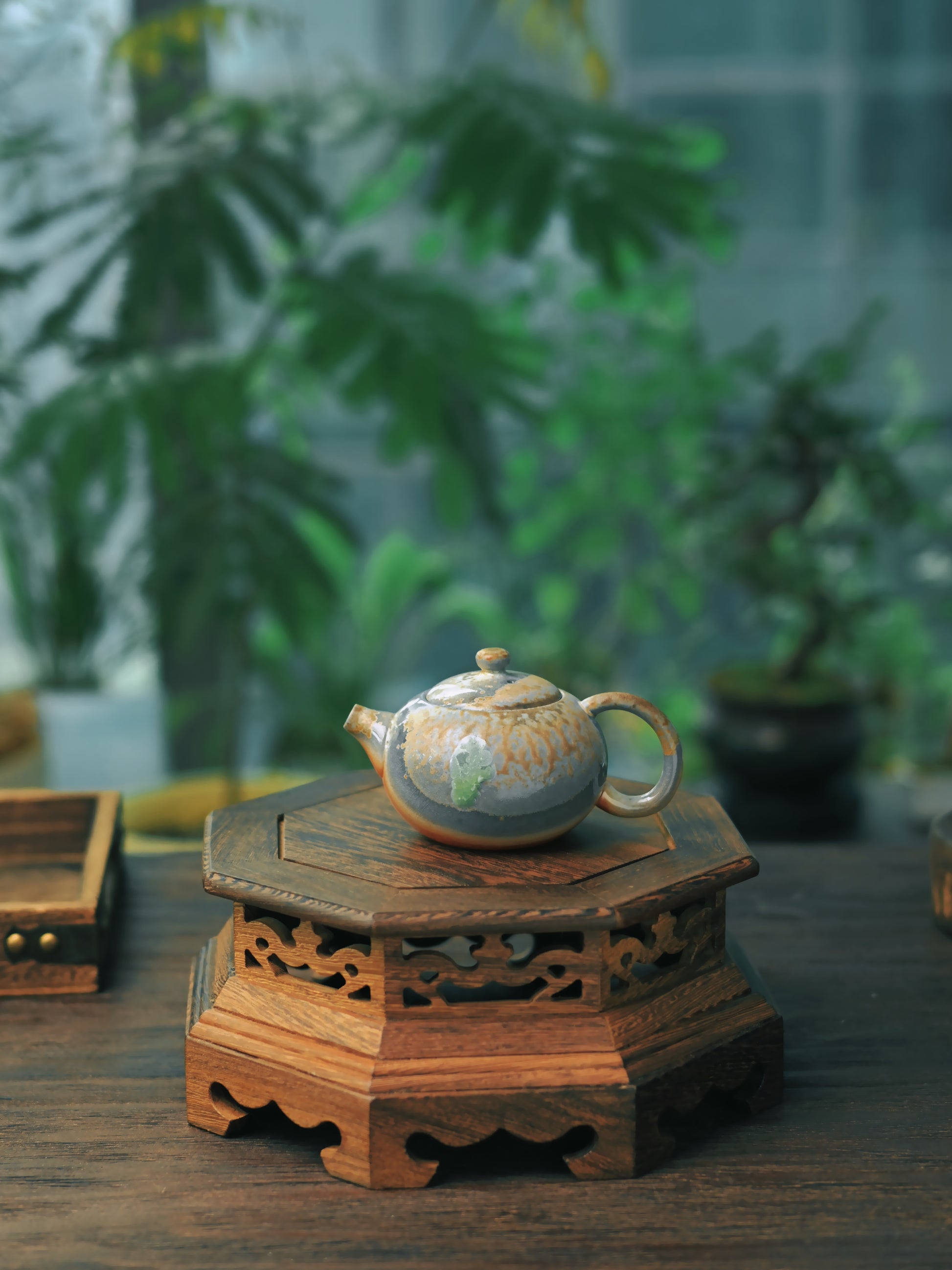 Anagama kiln-fired zisha teapot featuring natural ash deposition, crystalline glaze development, and dramatic flame patterning on the classic Xishi form