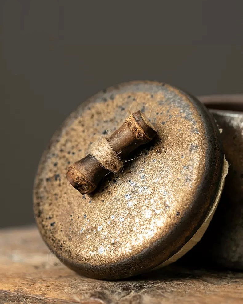 Top view of a vintage-style Chinese stoneware tea caddy with elegant lid.