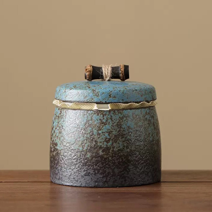Close-up of a handcrafted gilded stoneware tea caddy in vintage Chinese style.
