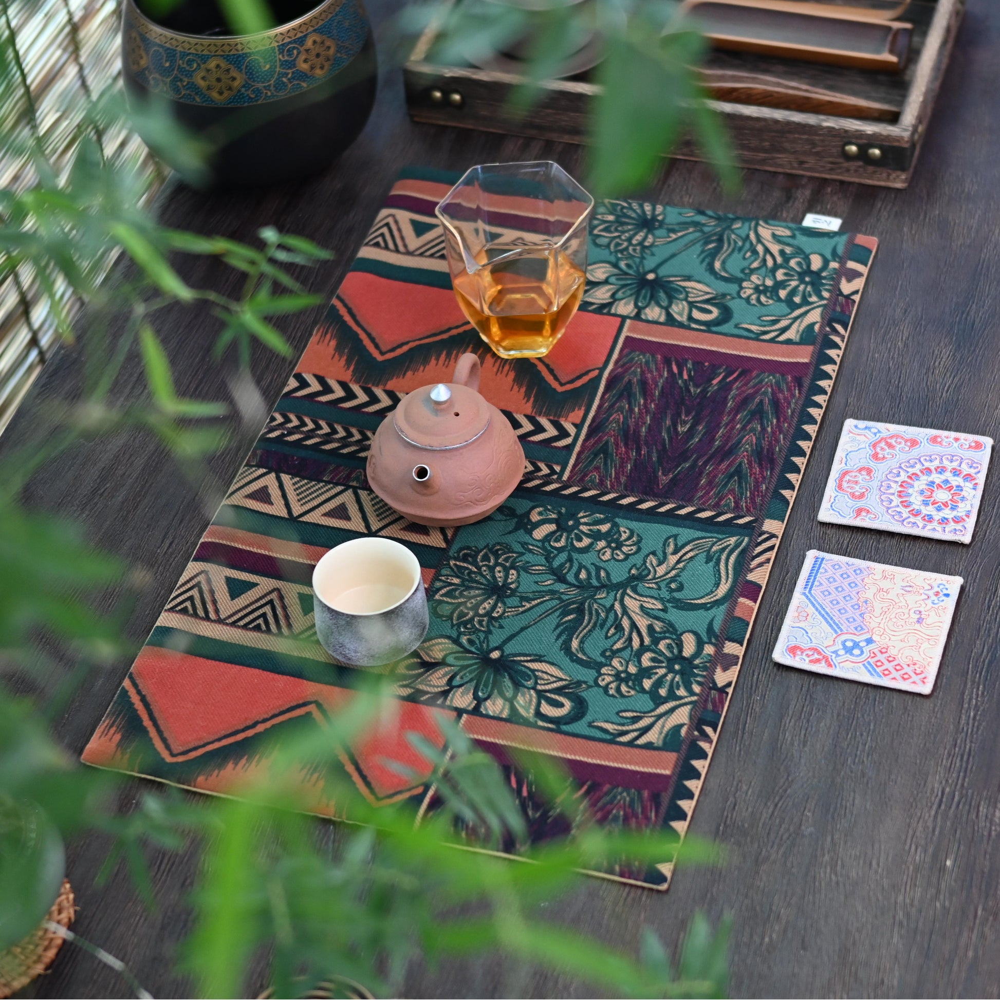 Nordic-inspired tea table accessory, cotton linen mat with vintage ethnic motifs.