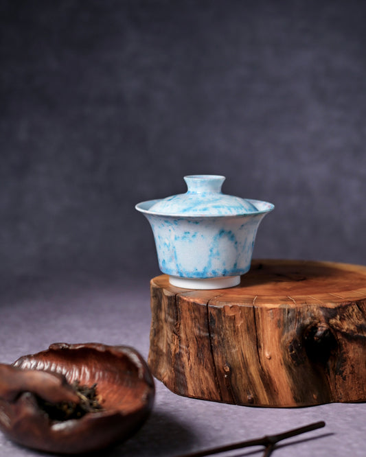 Interior of wood-fired tea bowl showing turquoise crystal textures resembling frost or nebula formations