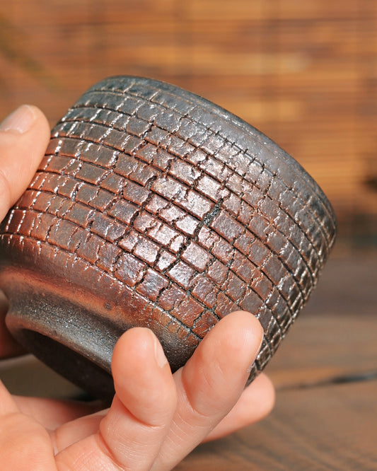 Three-dimensional granular texture on handmade iron-clay ceramic cup
