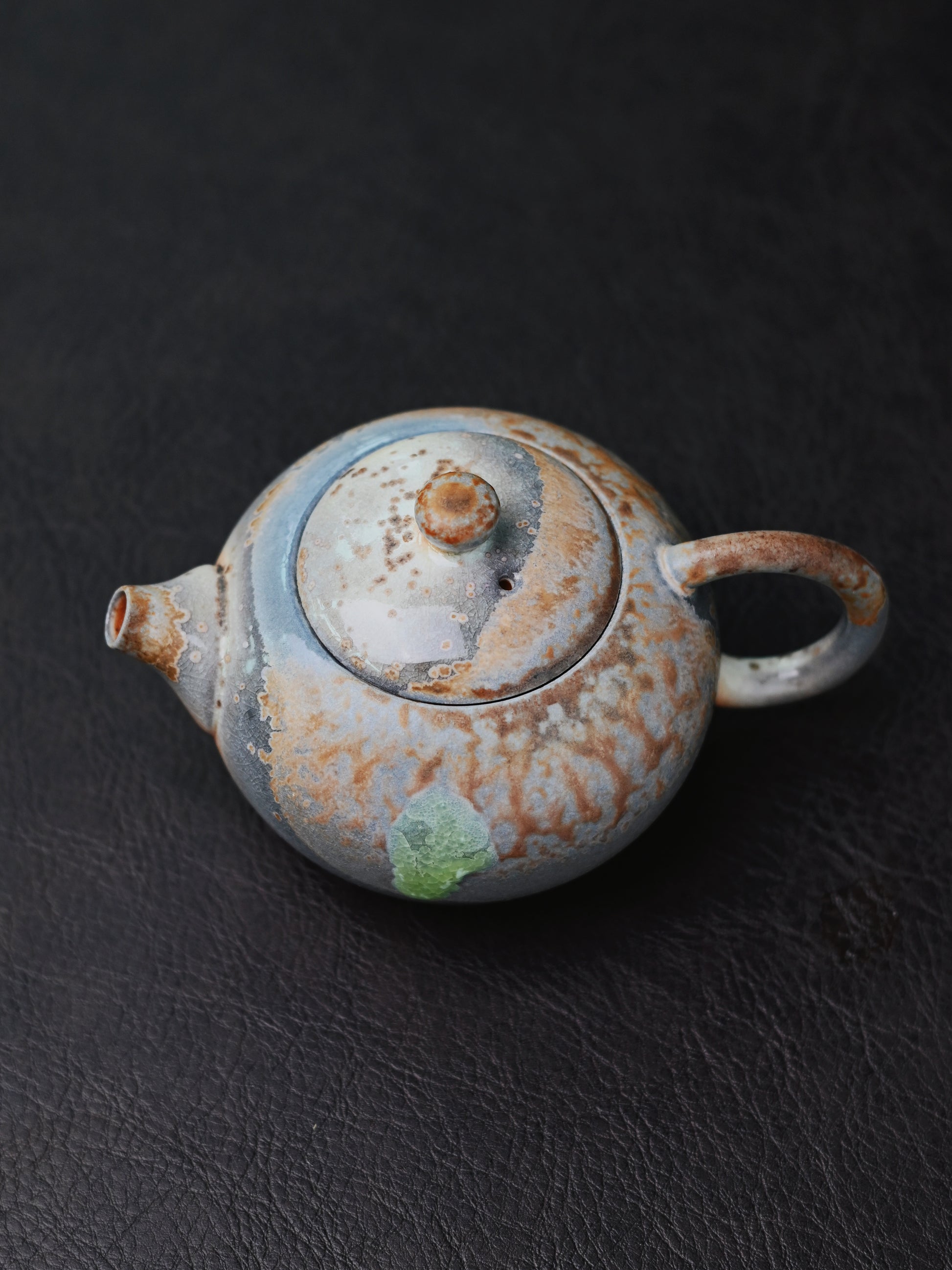 Wood-fired Xishi teapot with natural ash glaze, crystalline surfaces, and flame marks - fully handbuilt in Yixing through traditional dragon kiln firing