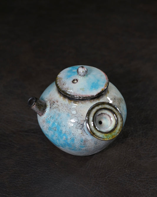 Unglazed interior teapot with raw Kohiki slip surface for tea interaction during brewing