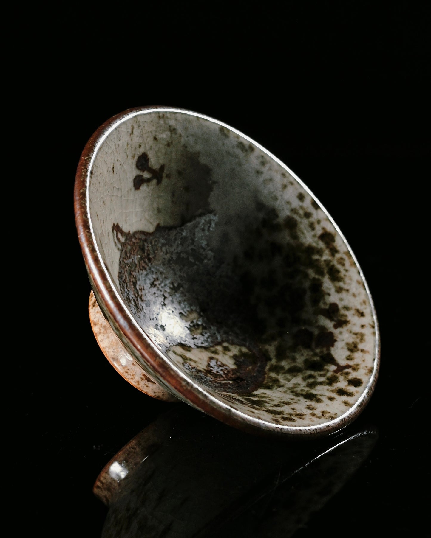 Douli style tea cup with rustic ash glaze surface, displaying unique crackle patterns and mineral variations