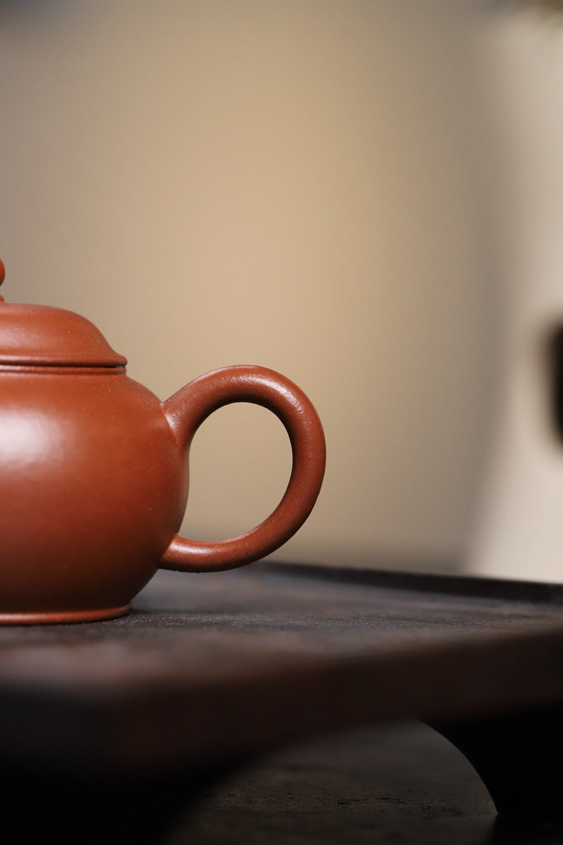 Semi-handmade Yixing teapot from 1990s discovered Jiangpo clay, featuring unique coloring properties