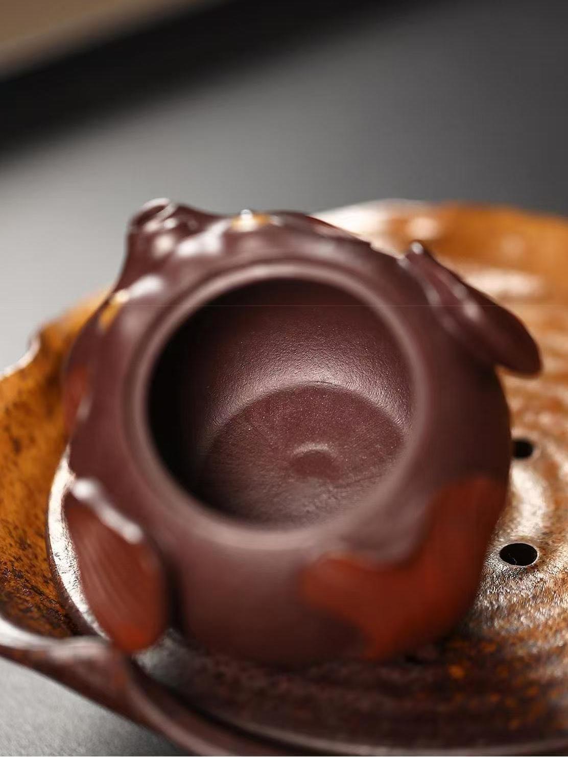 Charming pufferfish-shaped Yixing teapot - unique gift for tea enthusiasts featuring premium purple clay and elegant pouring performance.