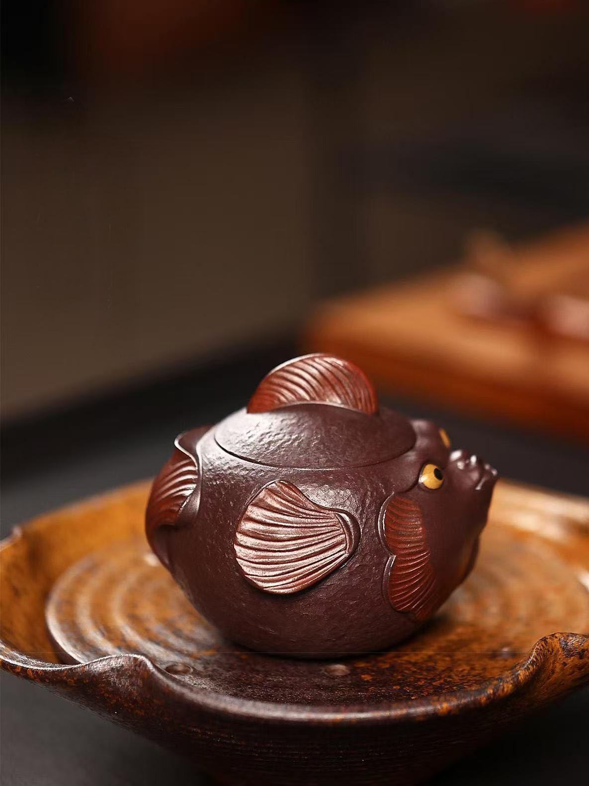 Traditional Yixing zisha techniques meet playful pufferfish design in this fully handcrafted teapot with modern functionality.