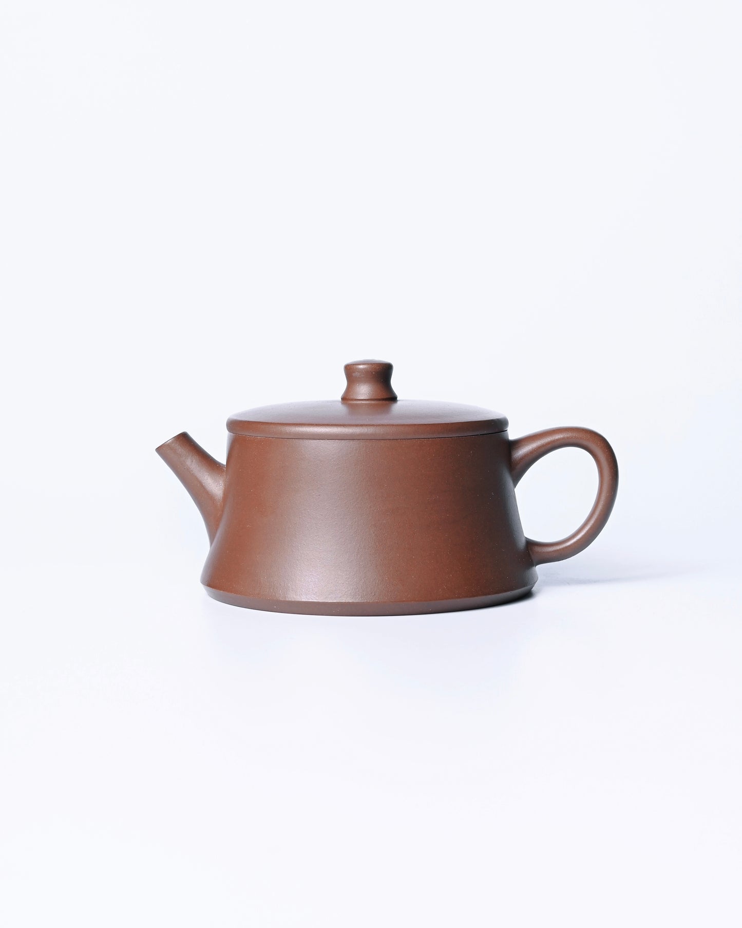 Collector’s Yixing teapot displayed on a wooden tea tray