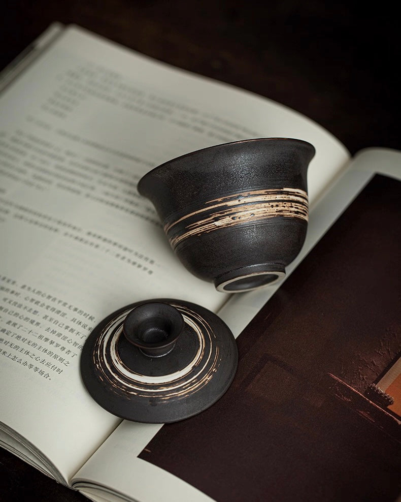 Saanwu Studio Zen tea ceremony gaiwan with wabi-sabi aesthetic, featuring irregular form and tactile clay surface