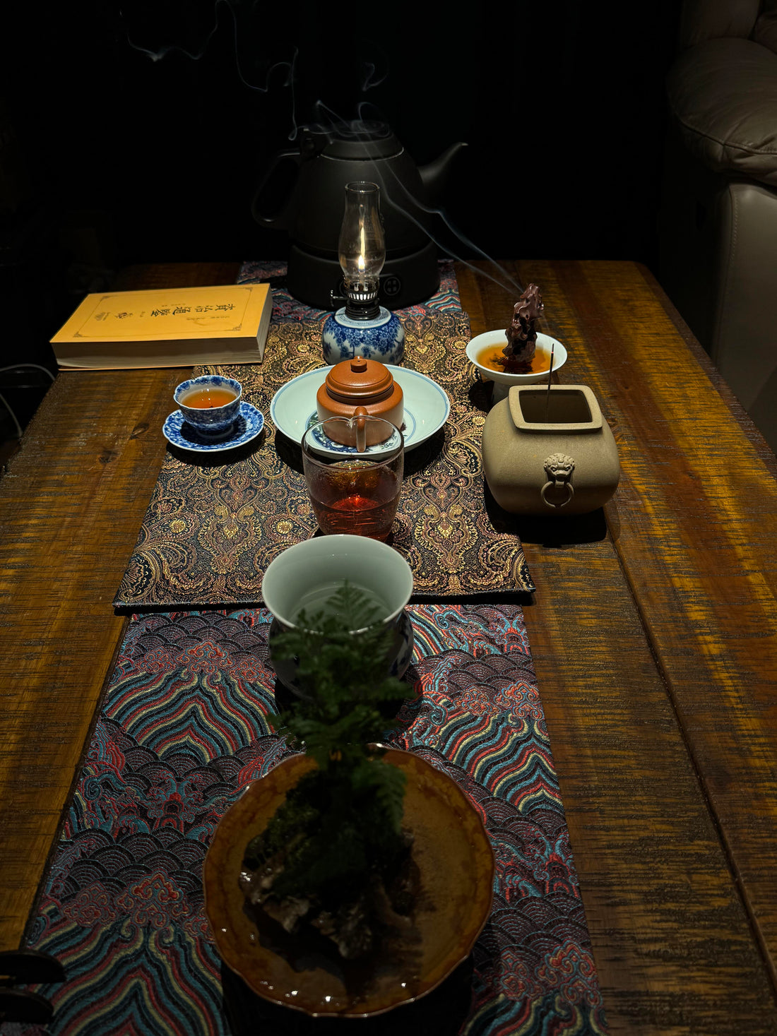 Explore the mineral texture, mica specks, and artisan soul of handcrafted Yixing teapots. Master the art of Zisha collection at Saanwu Studio.