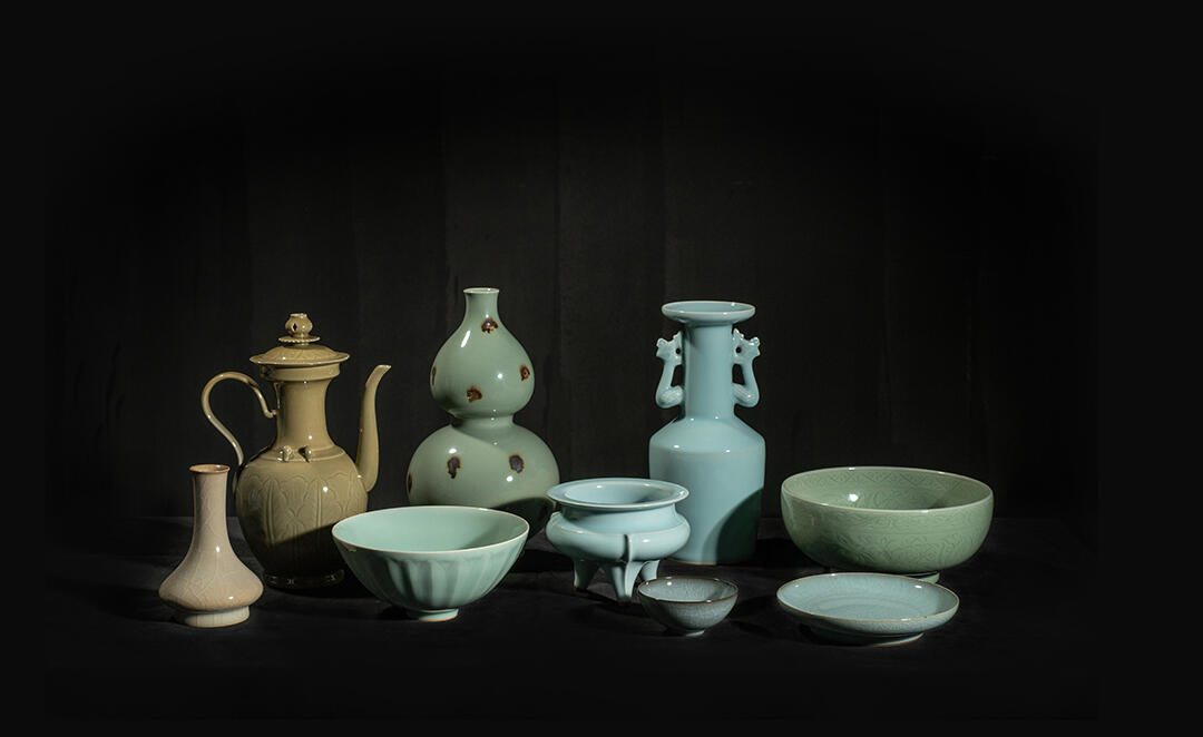 Longquan Celadon teapot, a masterpiece of Chinese intangible cultural heritage, showcasing elegant glaze, flowing form, and traditional craftsmanship.