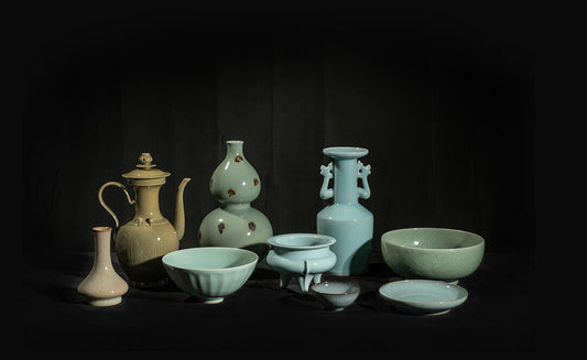 Longquan Celadon teapot, a masterpiece of Chinese intangible cultural heritage, showcasing elegant glaze, flowing form, and traditional craftsmanship.