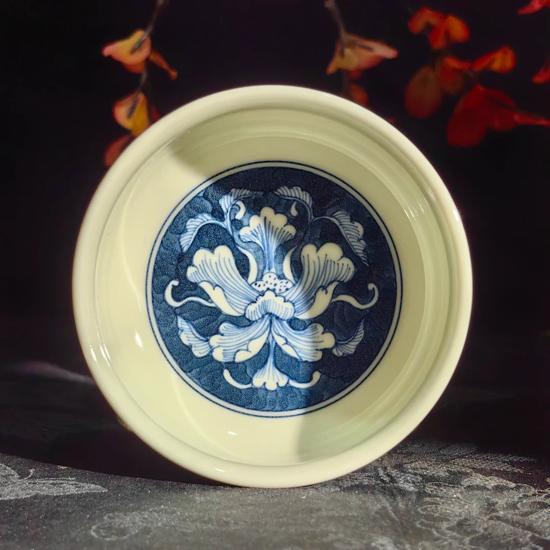 Artisan porcelain teacup featuring a refined rounded silhouette for Gongfu tea tasting.