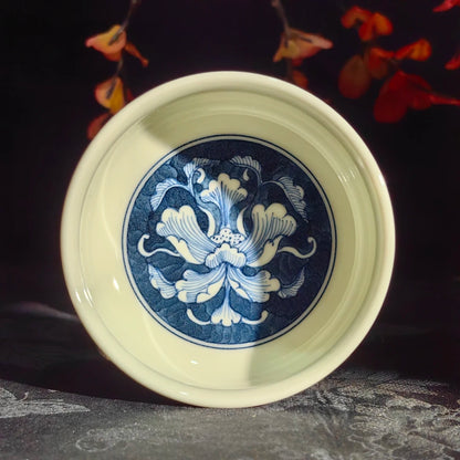 Artisan porcelain teacup featuring a refined rounded silhouette for Gongfu tea tasting.