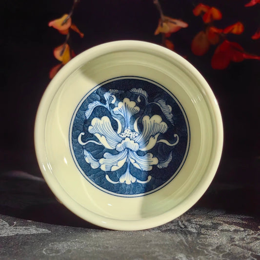 Artisan porcelain teacup featuring a refined rounded silhouette for Gongfu tea tasting.