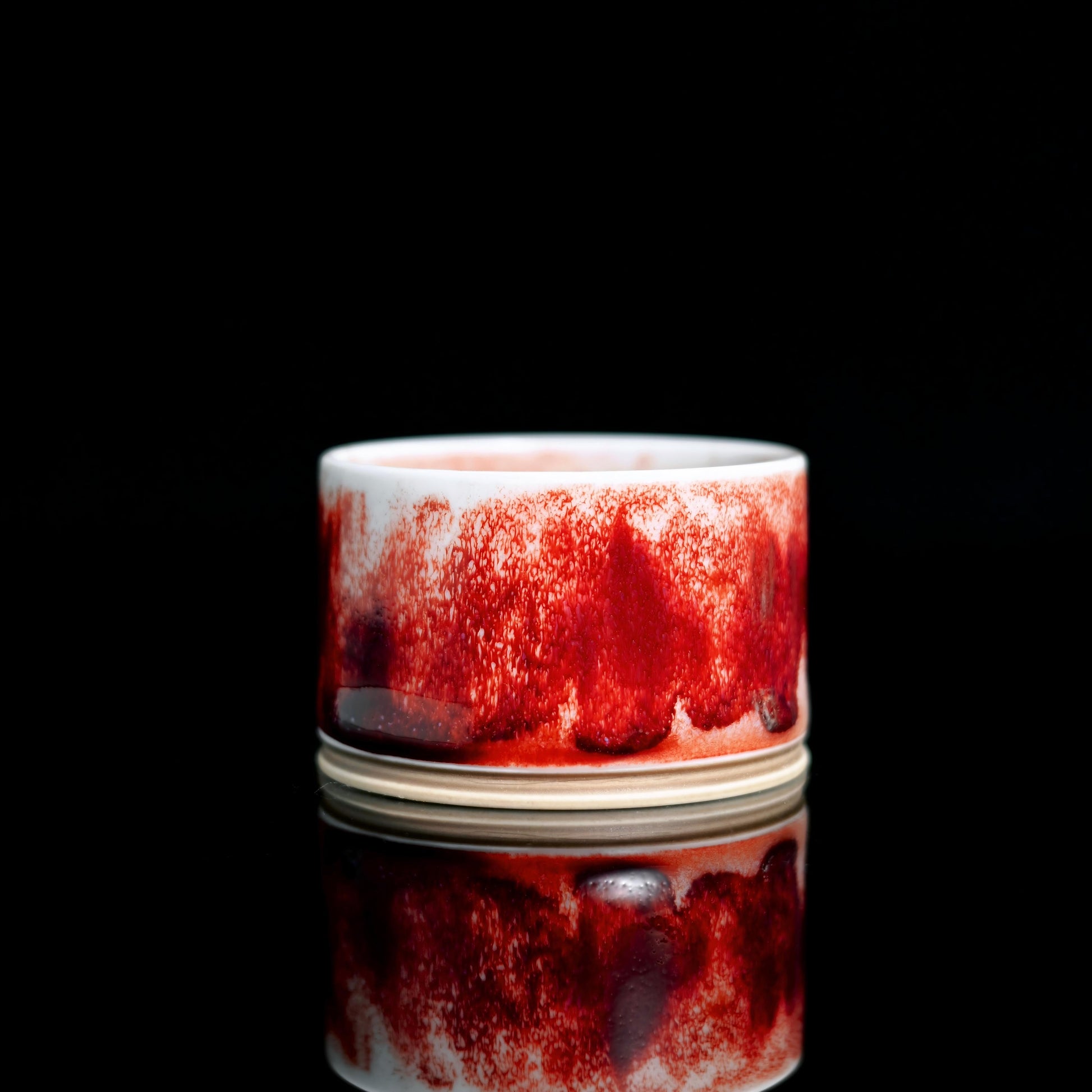 Jun porcelain cup fired at 1350°C in reduction atmosphere with mineral-reactive glaze