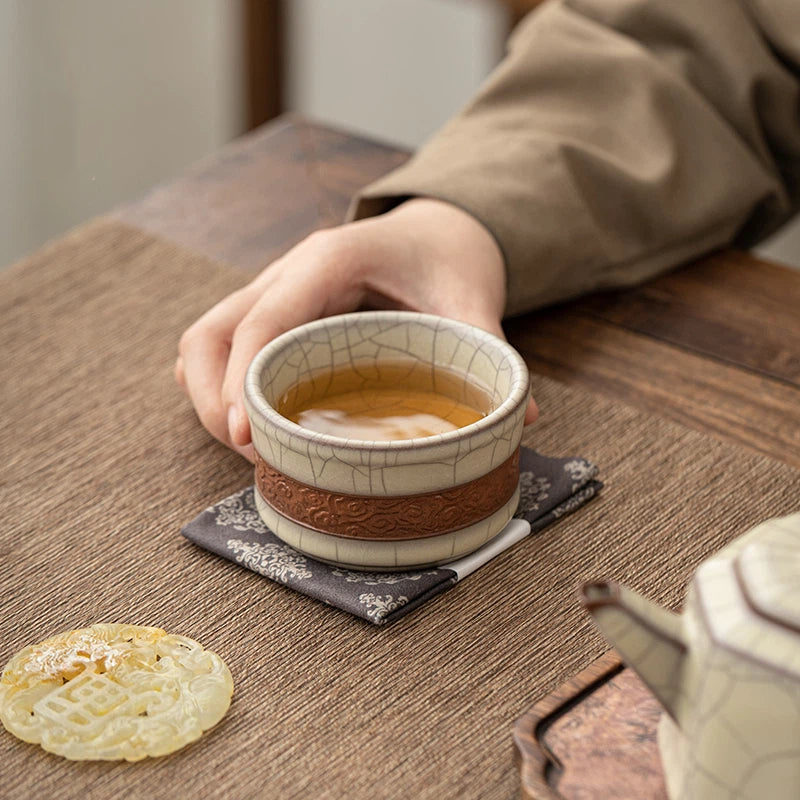 Longquan Celadon Ge Kiln Crackle Carved Hand Teacup