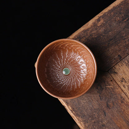 Artisanal wood ash fired teacup with a unique contrast between a ribbed interior and a smooth sculptural exterior.