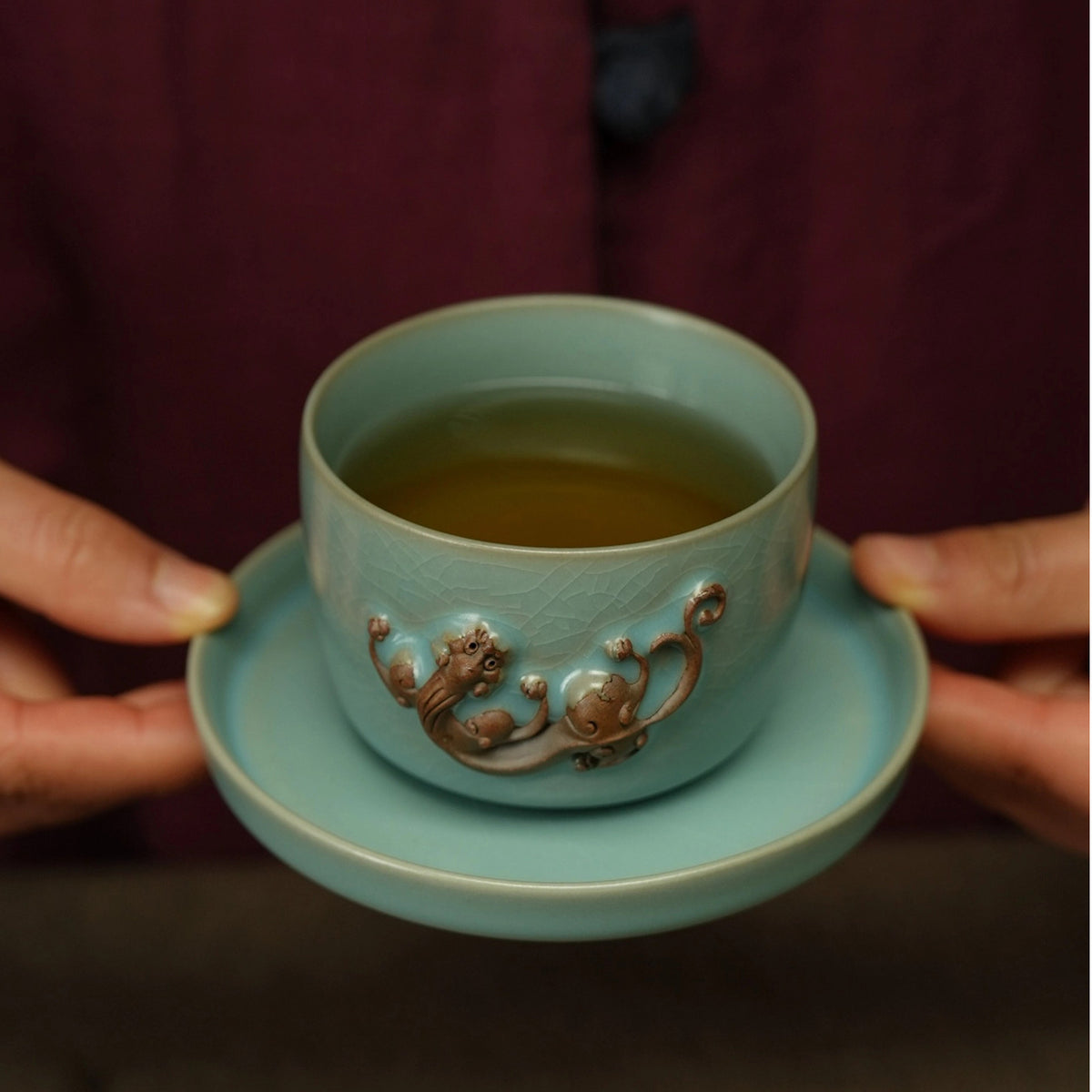 Gongfu tea setup featuring Ru Ware sky-blue 150ml Chi dragon master cup on dark tea table