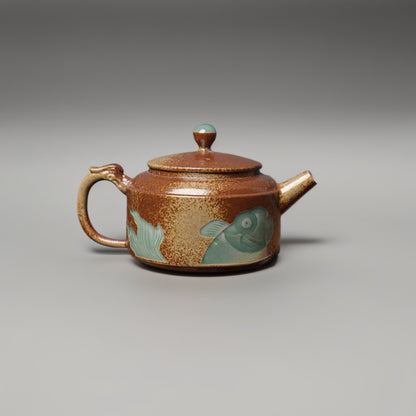 Longquan-Celadon-Teekanne in Pflaumengrün mit Pflanzenaschelasiert