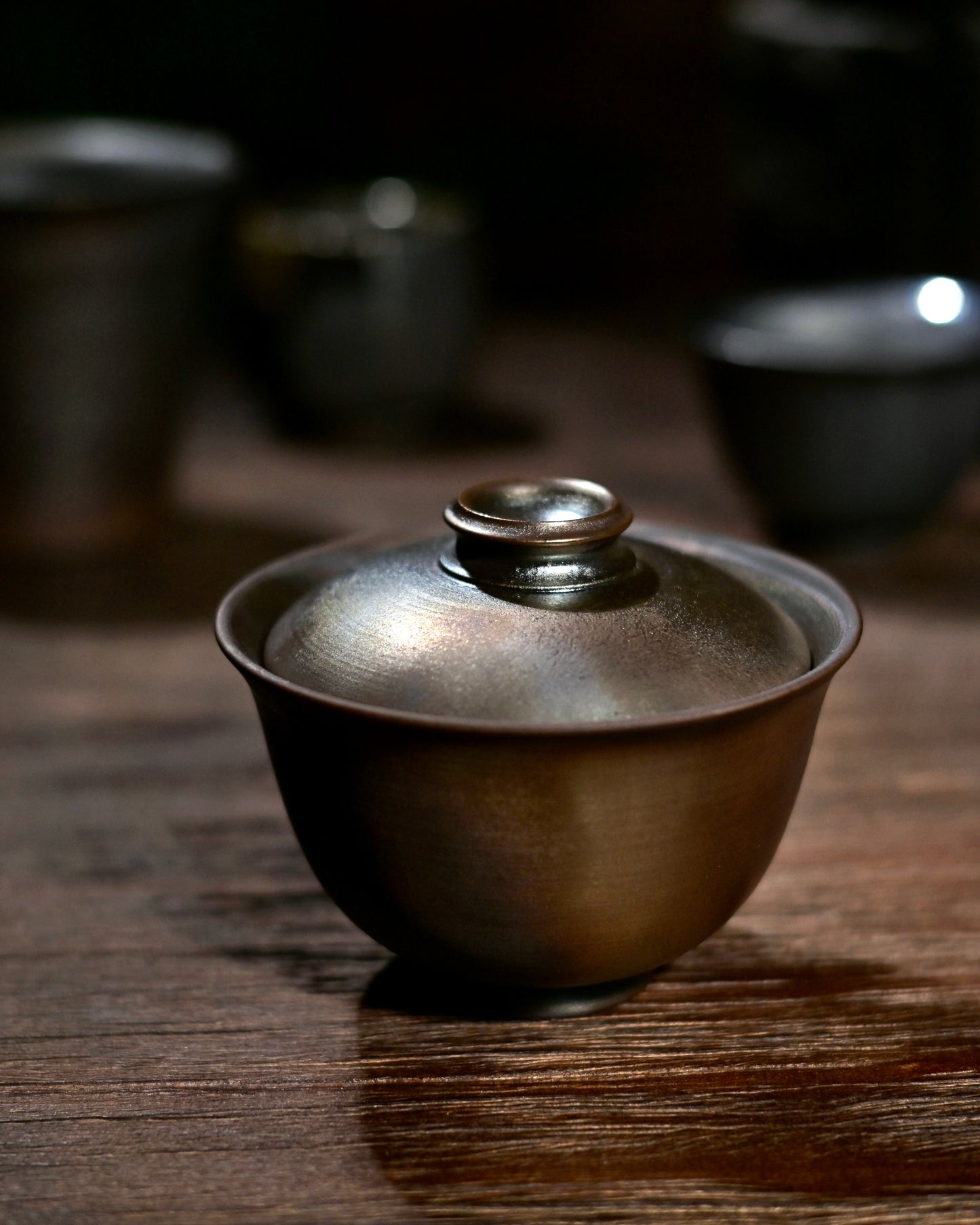 Wabi-sabi style iron clay Gaiwan for Gongfu tea ceremony, side view.
