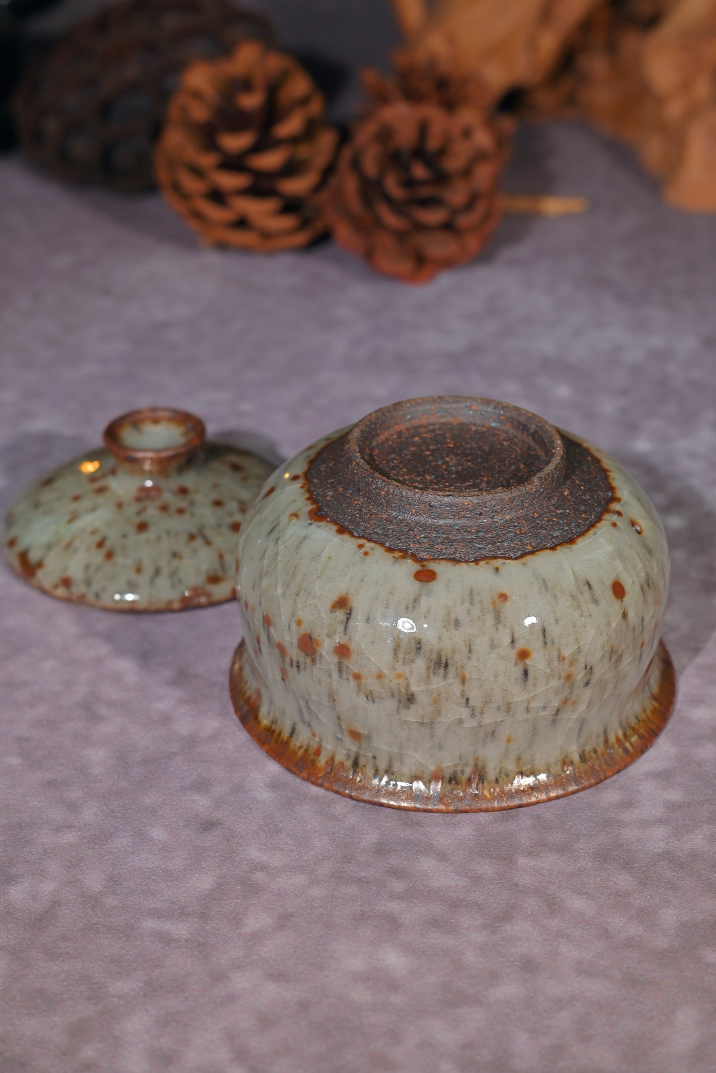 Minimalist tea set with white crackle glaze and unique iron-oxide patterns from the kiln.