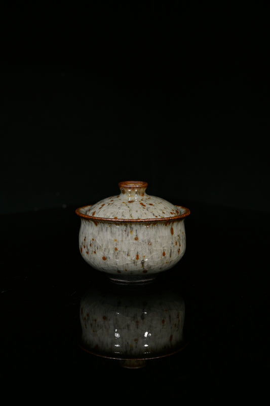Artisan-made Shino porcelain tea set featuring a rustic "Leopard Rain" glaze texture.