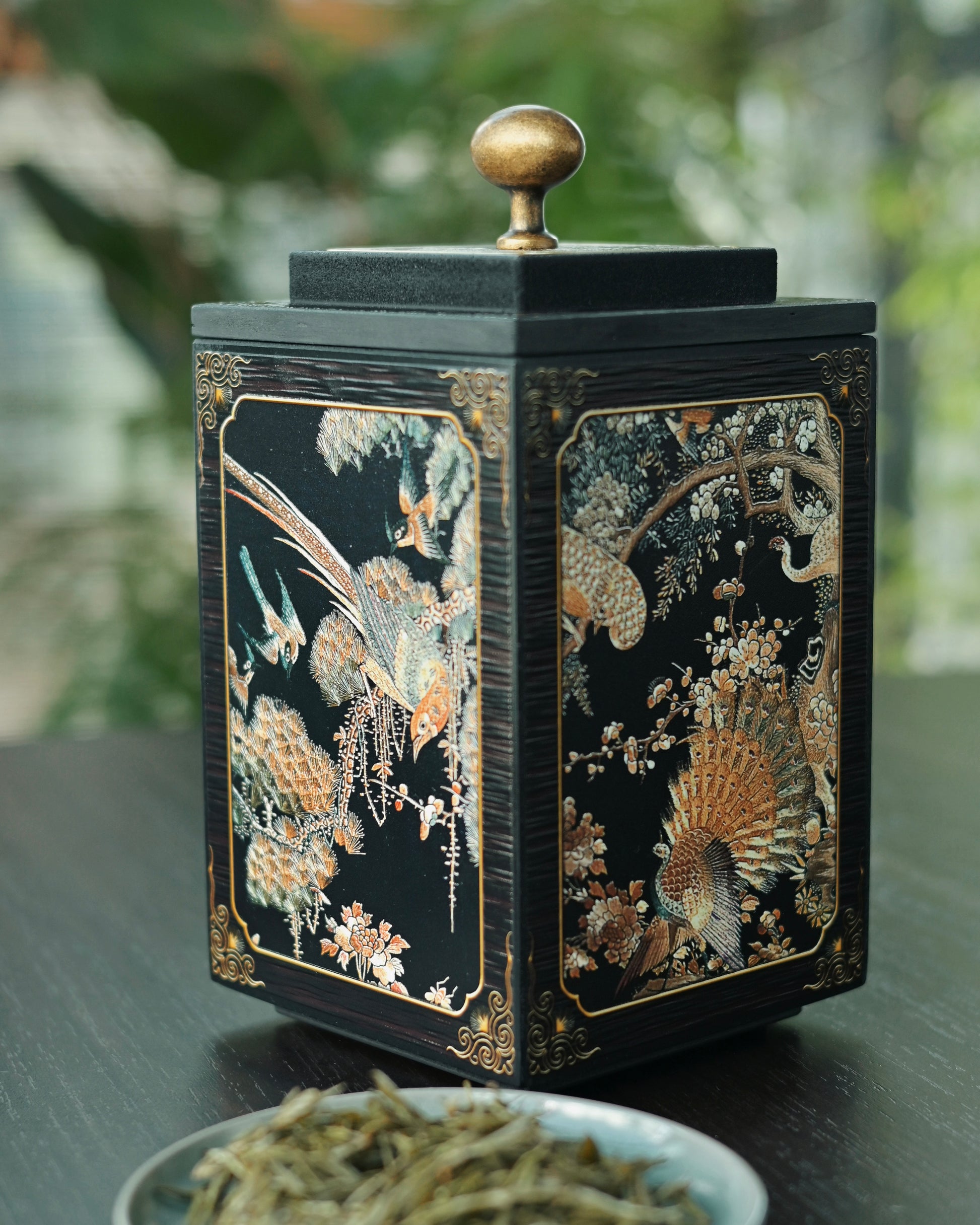 Palace lantern inspired tea caddy with intricate phoenix pattern, combining ancient design with modern materials