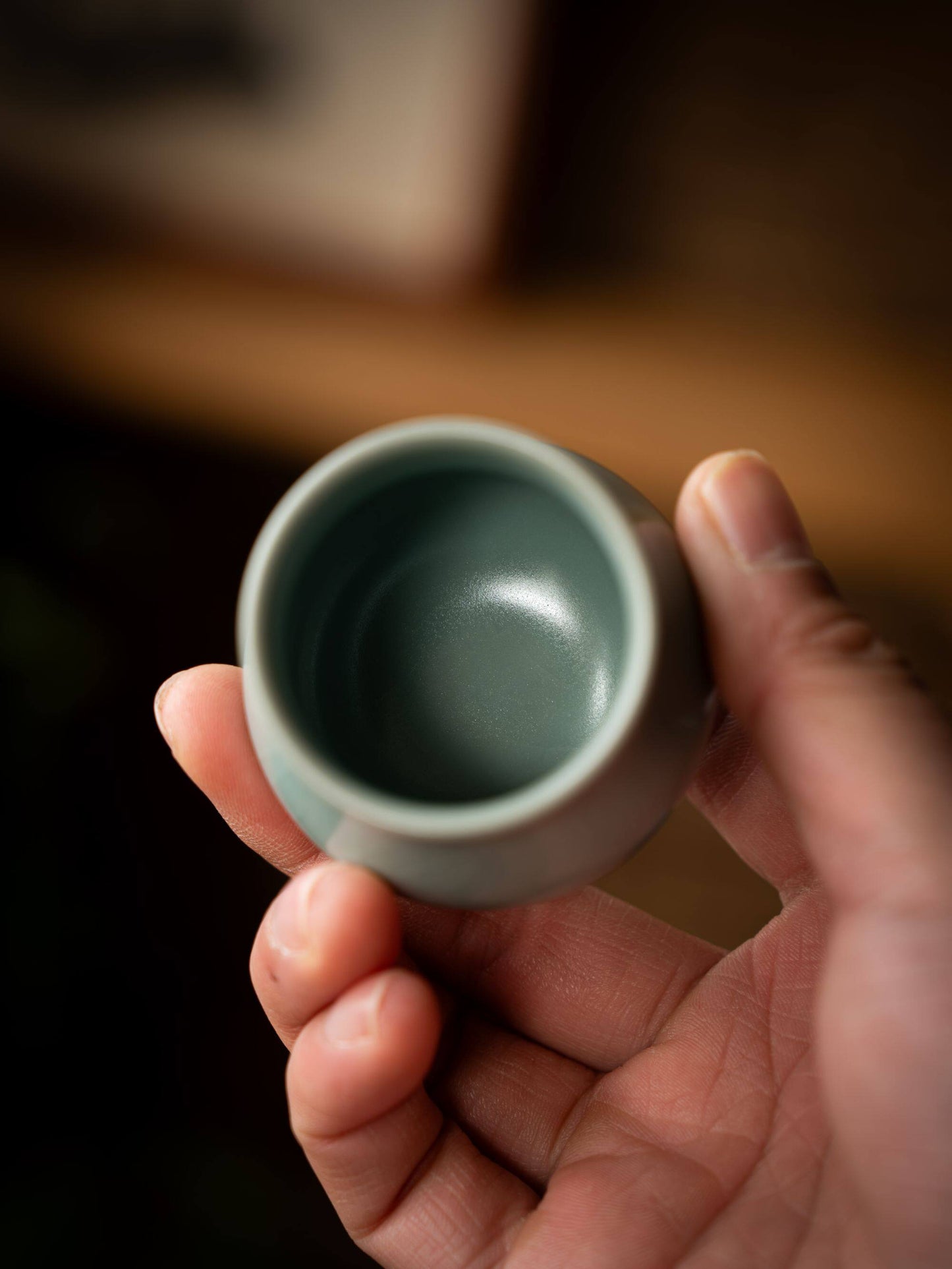 Micro-crackles on a sky-blue ceramic surface as shown in saanwu-ru-ware-teacup-80ml.jpg.