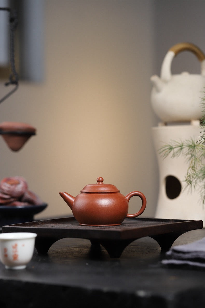 Artisan-made Jiangpo clay teapot ideal for light-roasted oolong, with unique colorful speckle pattern