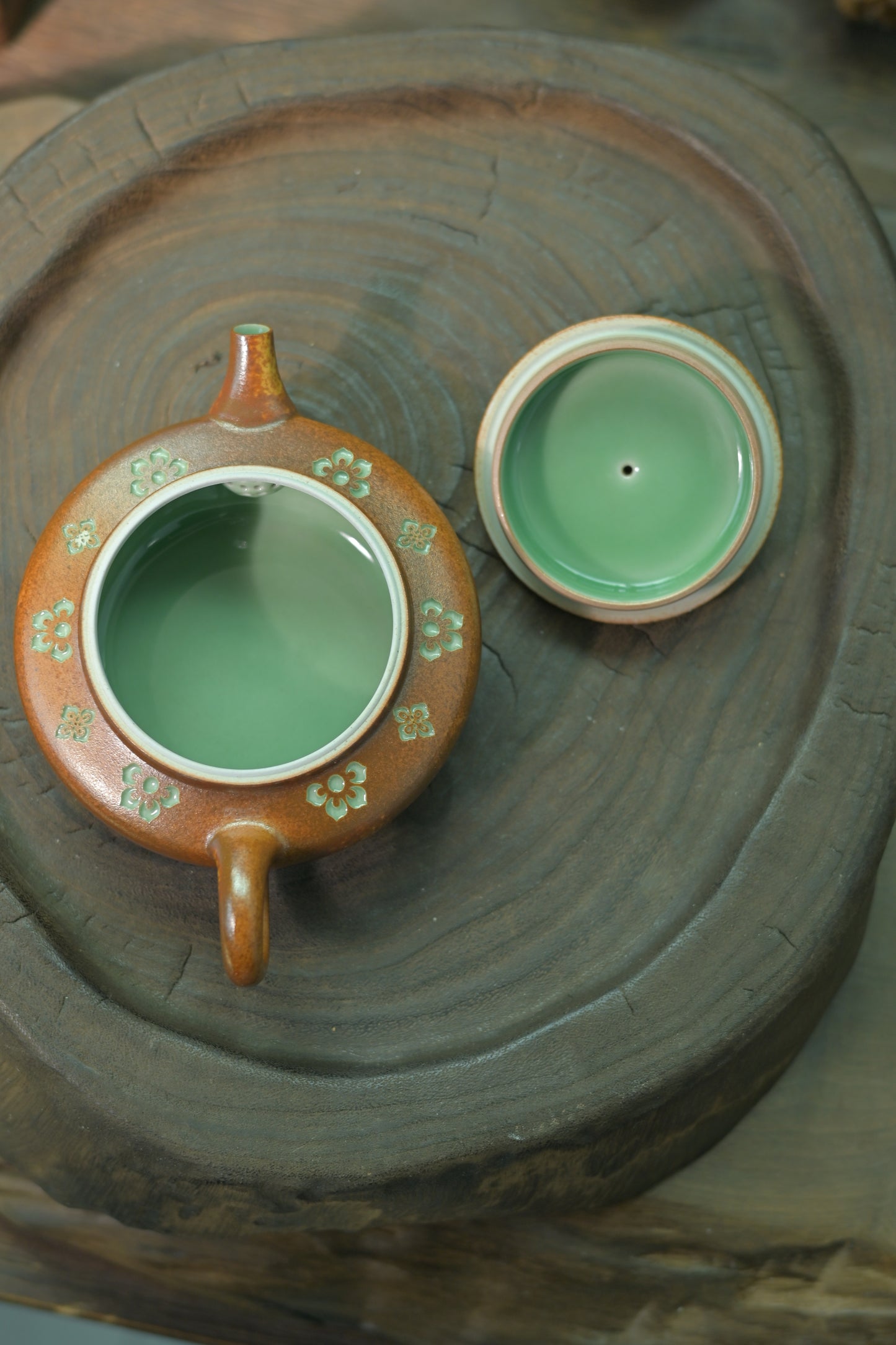 Artisan craftsmanship: precise carving and kiln-fired wood ash glaze on high-end tea ware