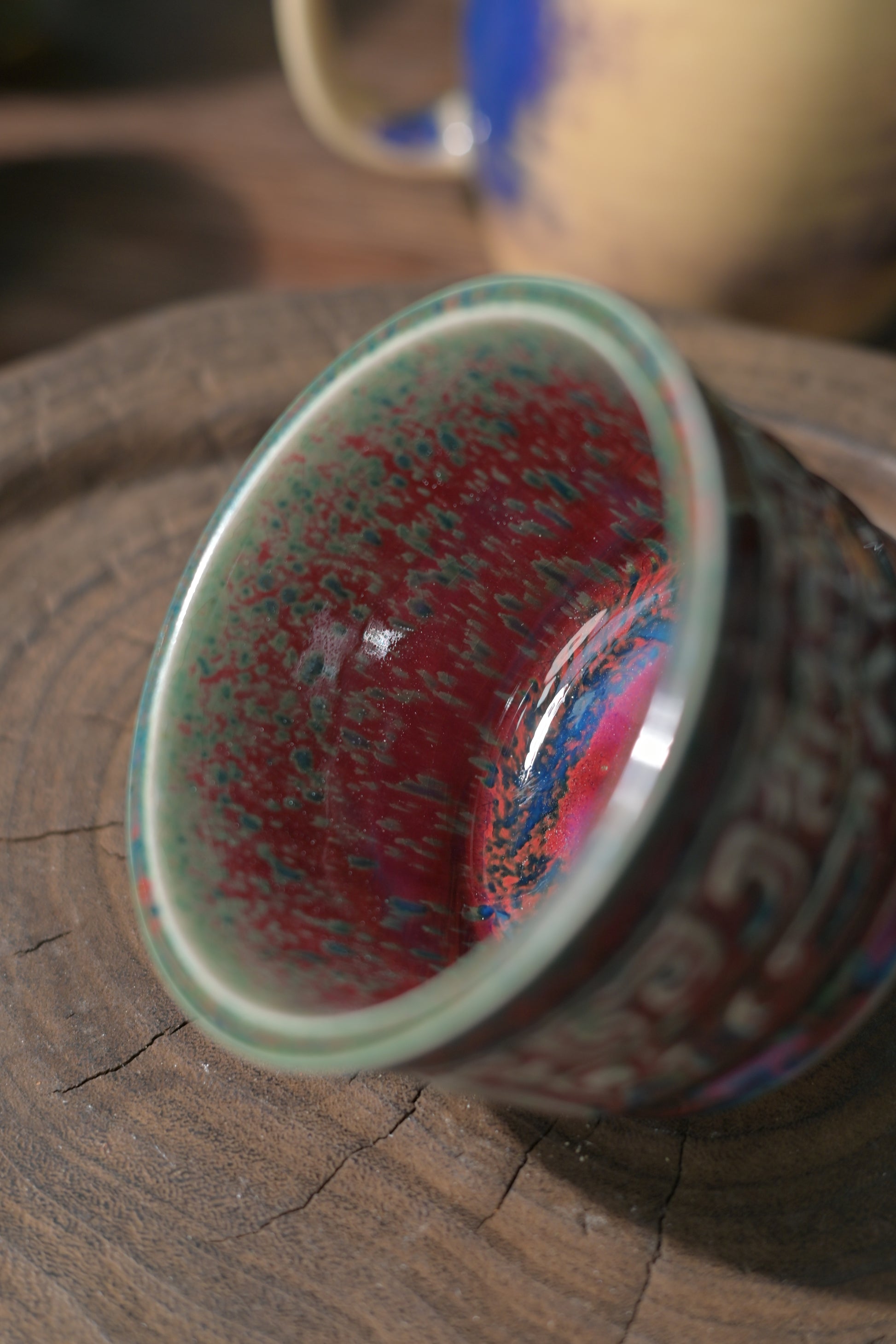 Close-up of embossed relief design on handmade Jun Kiln tea cup