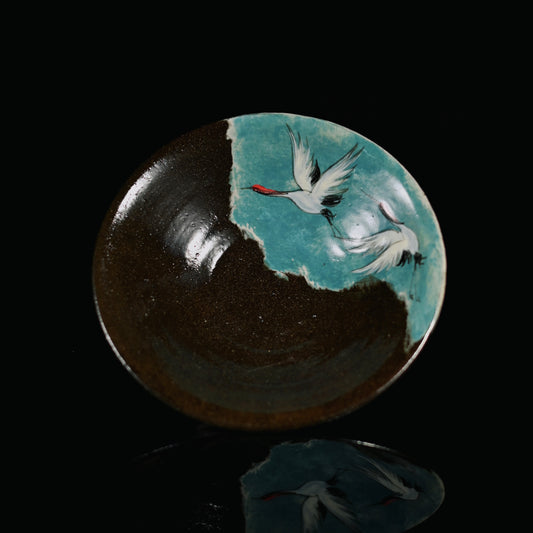 A fully handmade rough pottery drip tray from Jingdezhen, showcasing a striking contrast between the dark clay and hand-painted blue.