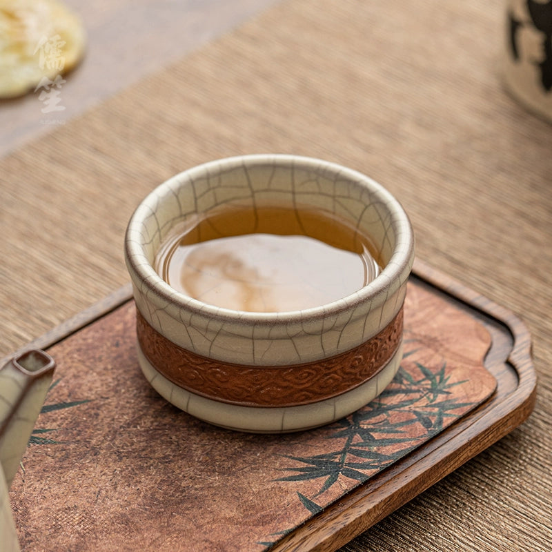 Longquan Celadon Ge Kiln Crackle Carved Hand Teacup