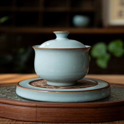 Elegant Ru porcelain gaiwan for Gongfu tea brewing, featuring a flared rim and authentic nail-fired base.