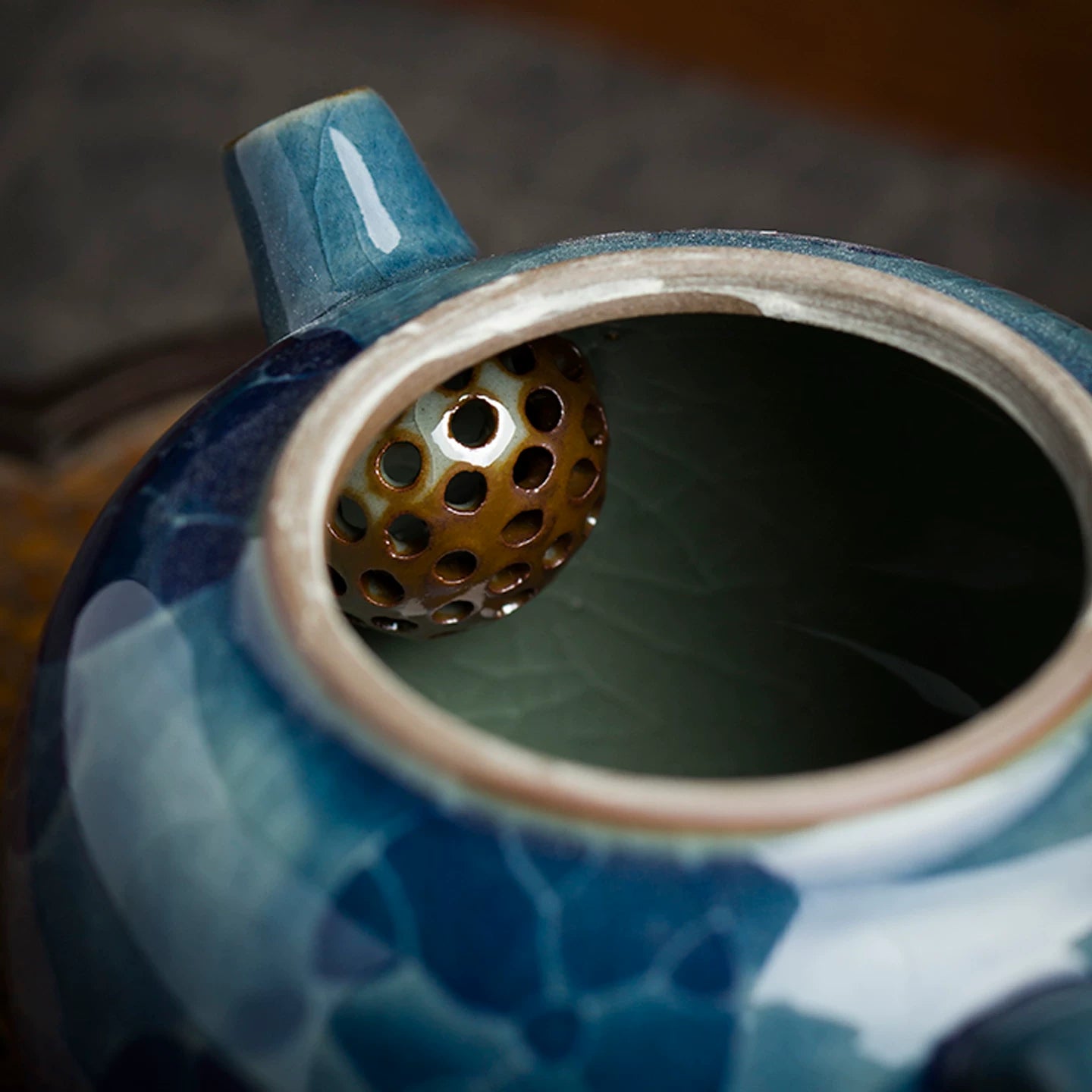 Traditional Chinese tea ritual centerpiece featuring a hand-painted lotus scene on white porcelain.