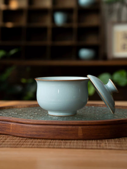 Elegant Ru Ware gaiwan set featuring translucent sky-blue glaze