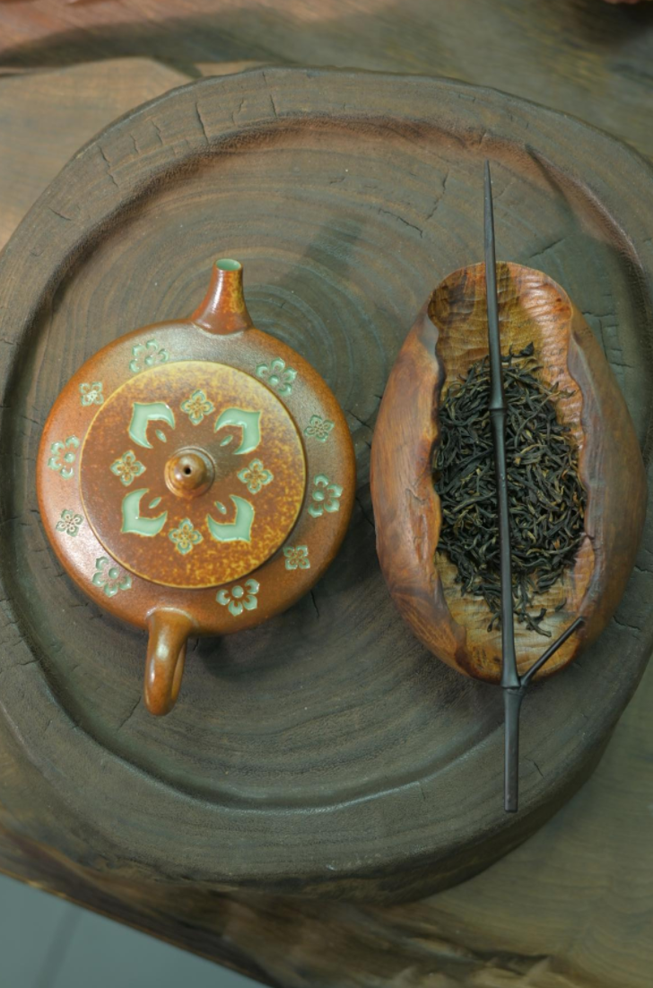 Sacred Baoxiang flower pattern symbolizing luck and prosperity on an artisan-made teapot