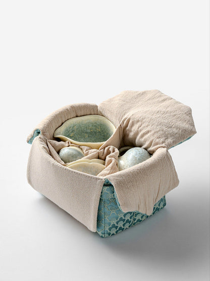 Ceramic teapot and teacup with smoky cyan glaze, traditional kiln-change finish
