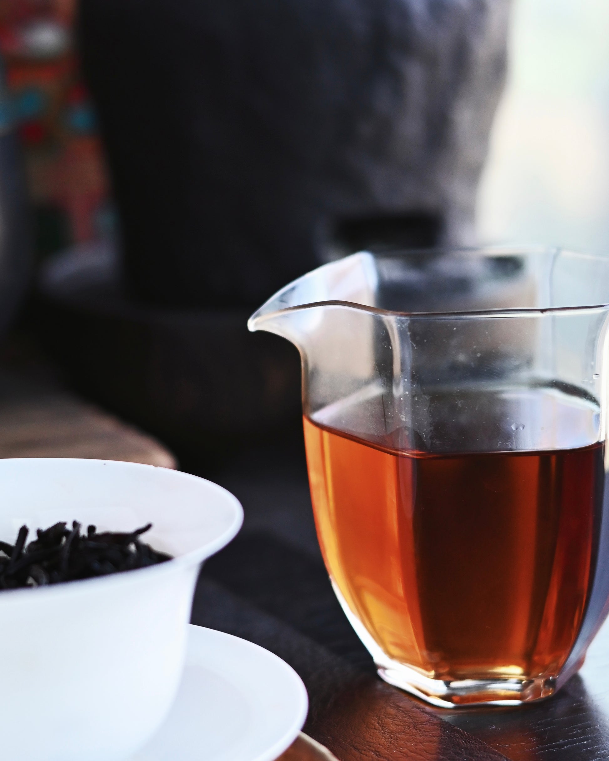 Deep ruby-red liquor of aged Liubao tea with thick texture