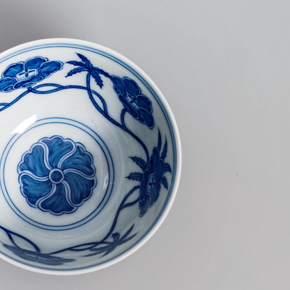 Twelve Palaces-inspired master cup: Jingdezhen handmade porcelain with Ming-style blue and white lotus symbolism, representing imperial ceramic artistry in thin-body form.