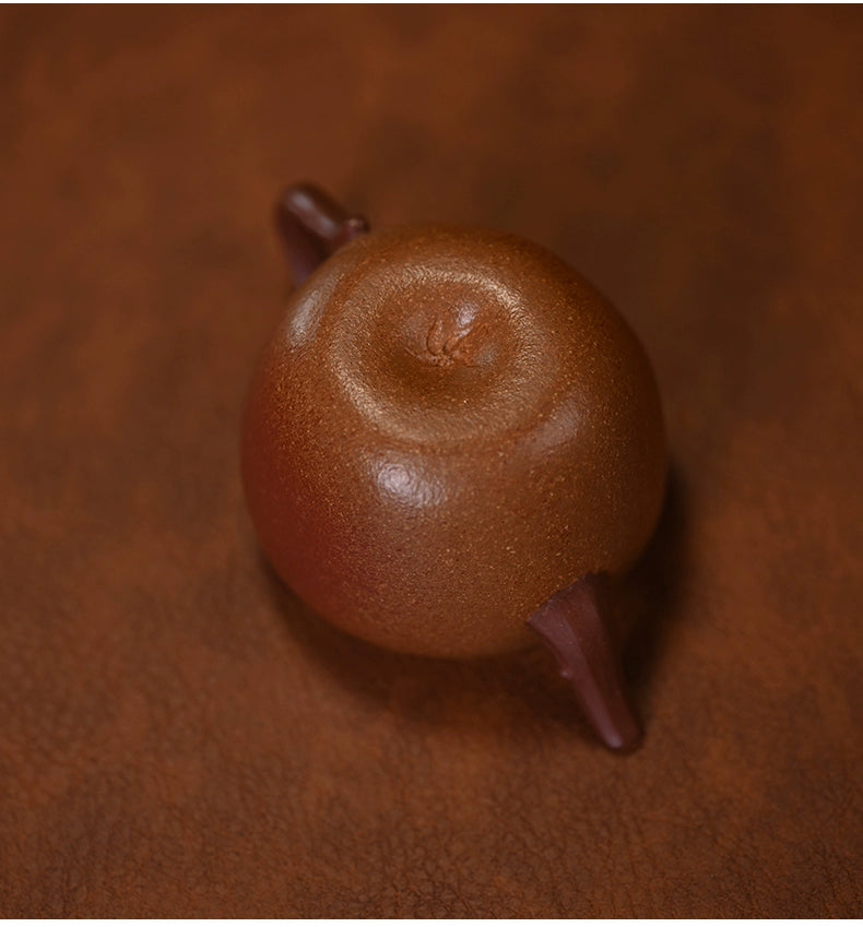 Yixing Zisha teapot placed on gongfu tea tray