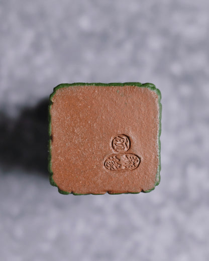 Archaic bronze style gai zhi featuring ancient protective beast imagery adapted for tea table use