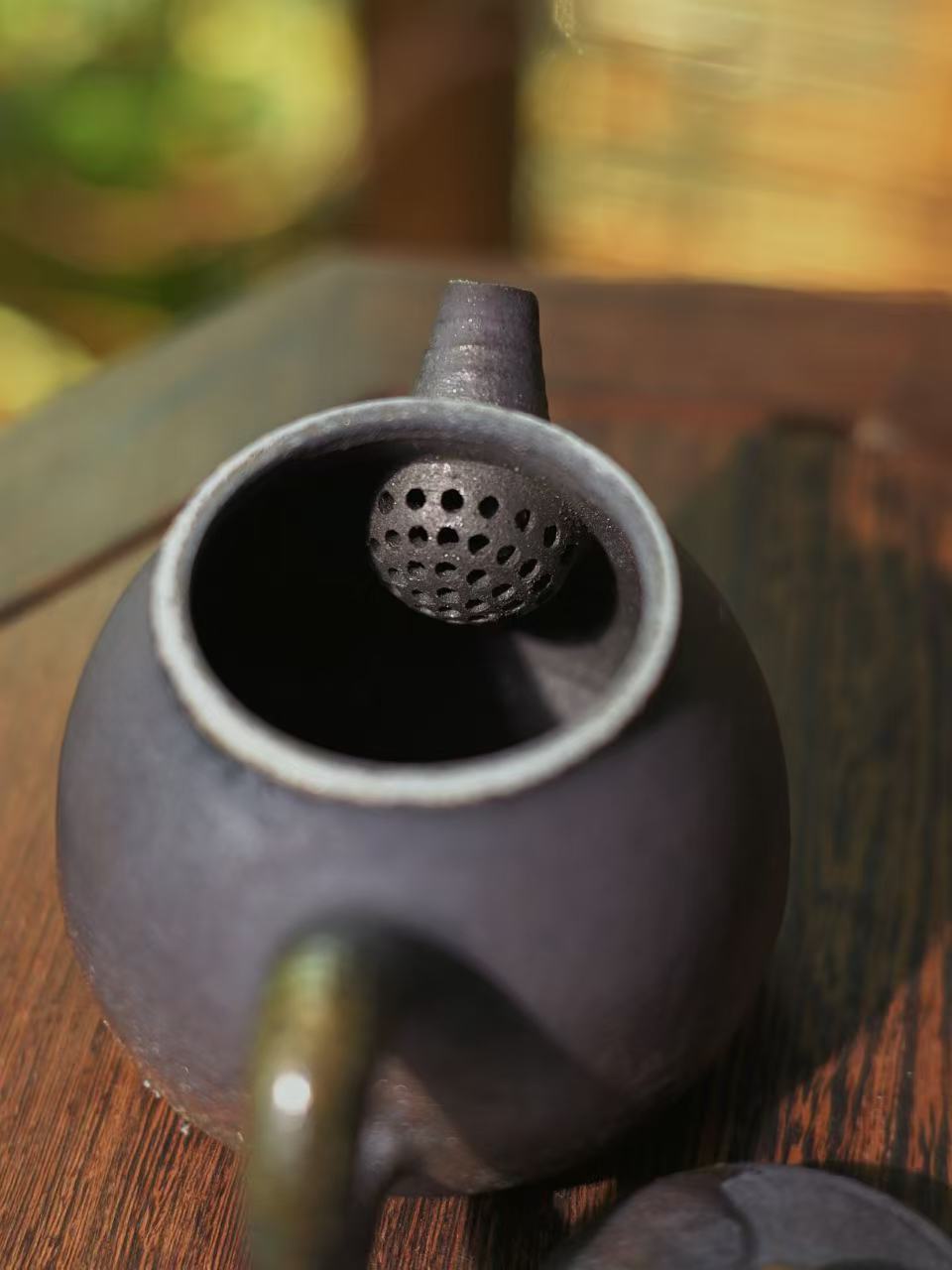 150ml artisan iron clay teapot featuring a precision spout and ergonomic handle.